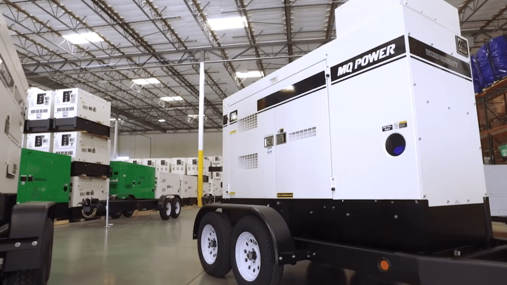 Photo of generator in warehouse with other generators